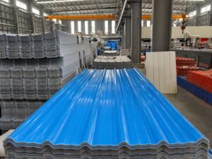 Stacks of corrugated plastic roofing sheets inside the HESU factory